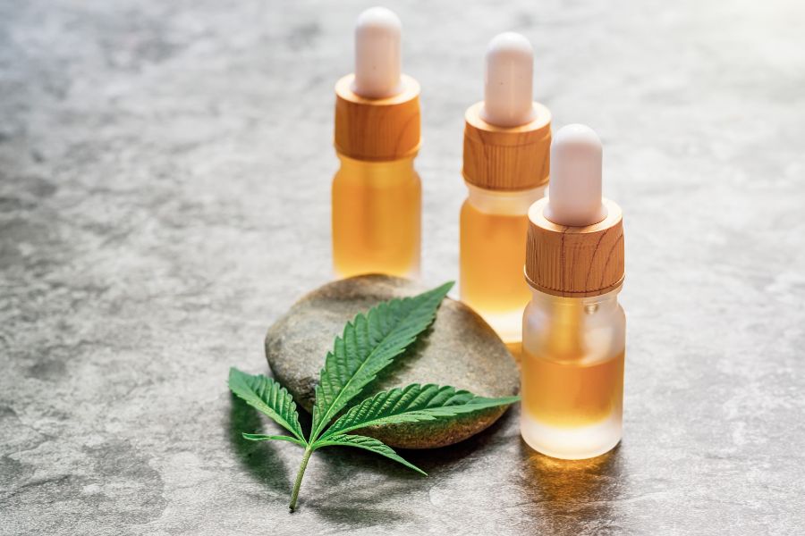 CBD or THC Full Spectrum Medical Cannabis Oils on Stone Table